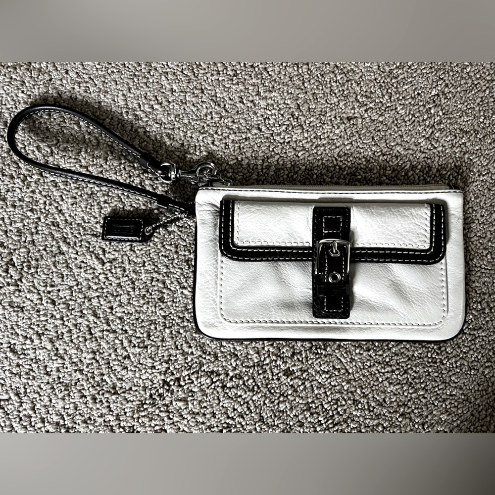White and dark brown leather Coach wristlet